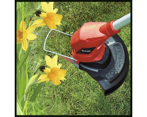 Logo Einhell vyžínač trávy v provozu na trávníku