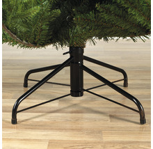 Detailní záběr černé kovové základny umělého vánočního stromku.