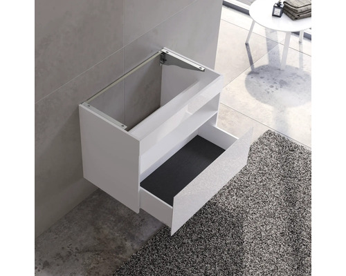 Bílý umyvadlový stolek pro montáž na stěnu s otevřenou zásuvkou a policí