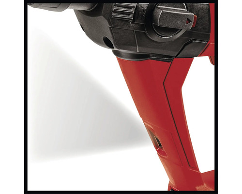 Detailní záběr vrtačky s červeným pouzdrem a černým ovládacím prvkem