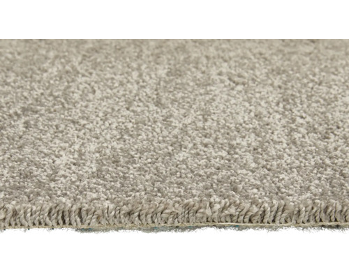 Detail světlého koberce se smyčkovou strukturou