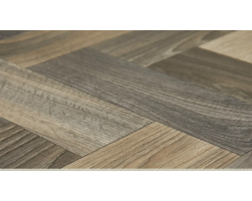 Detail laminátové podlahy se vzorem rybí kosti