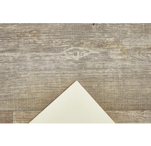 Dekorativní deska s dřevěnou strukturou a světlým papírovým rohem