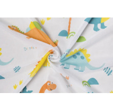 Látka se vzorem dinosaurů