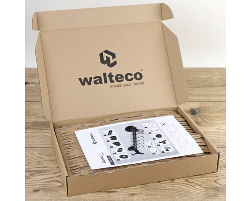 Otevřená kartonová krabice s obalem produktu a návodem