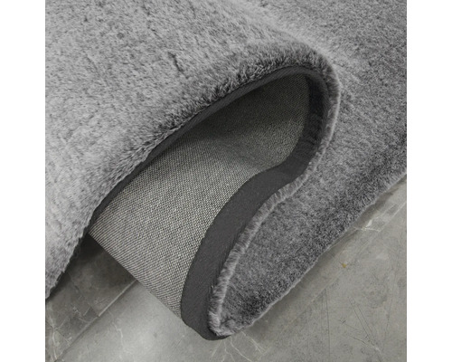 Detail šedého koberce s vlasem