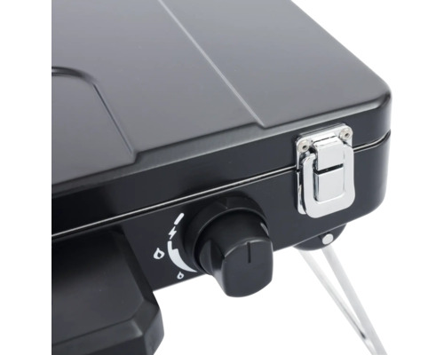 Detail přenosného plynového vařiče s otočným knoflíkem a uzávěrem