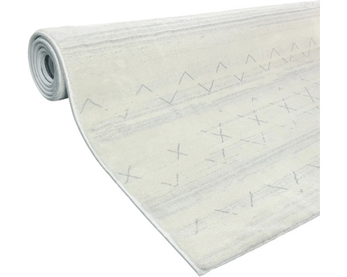 Srolovaný koberec se vzorem