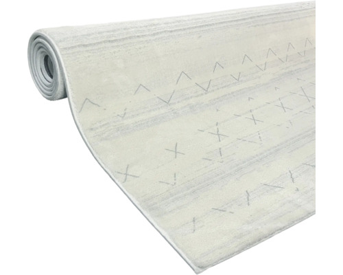 Srolovaný koberec se vzorem