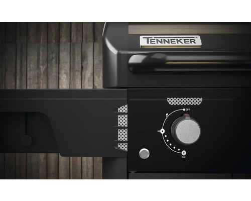 Detailní pohled na černý plynový gril Tenneker s otočným knoflíkem pro regulaci teploty.