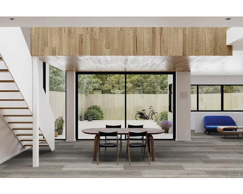 Světlý obývací pokoj se schodištěm, jídelní soupravou a šedou podlahou