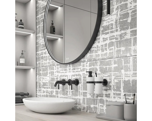 Moderní koupelna s kulatým zrcadlem, umyvadlem a šedými obklady