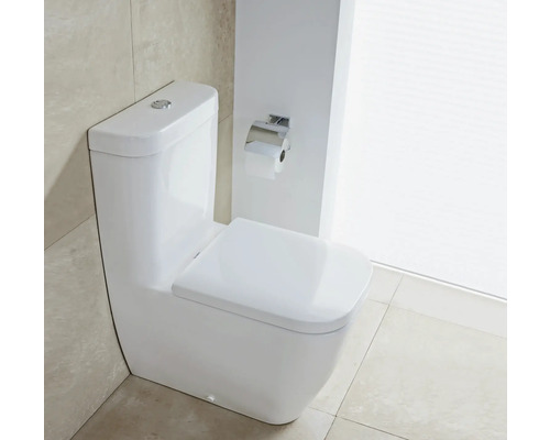 Bílá stojící toaleta s držákem na toaletní papír