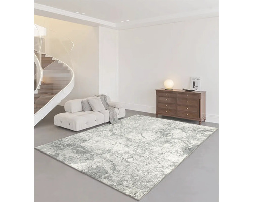 Obývací pokoj s pohovkou, komodou a abstraktním kobercem