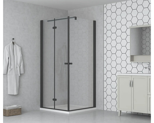 Koupelna se sprchovým koutem s otočnými dveřmi, umyvadlem a šestiúhelníkovými dlaždicemi