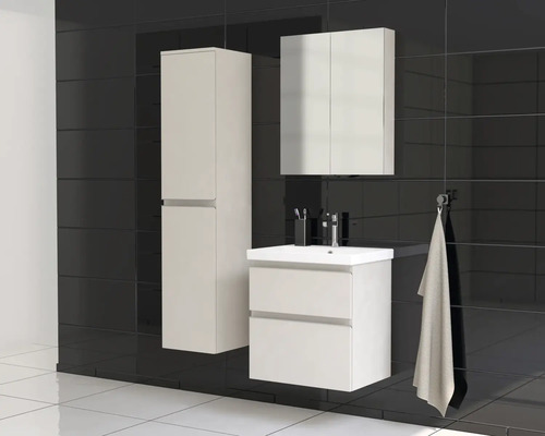 Moderní koupelnový set s umyvadlem, zrcadlovou skříňkou a vysokou skříňkou před černým obkladem