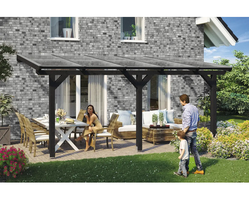 Zastřešení terasy SKAN HOLZ Andria 541 x 250 cm, laminované dřevo antracit Zastřešená terasa se zahradním nábytkem a rodinou na zahradě.