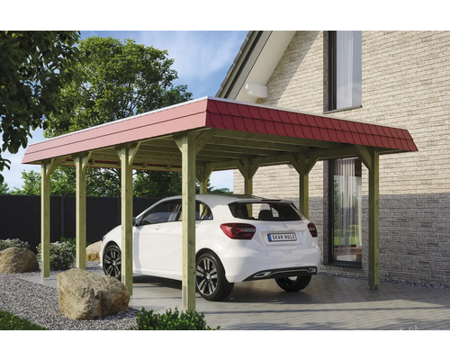 Přístřešek na auto SKAN HOLZ Spreewald červený vč. sloupkových kotev, 396 x 589 cm impregnovaný Volně stojící dřevěný přístřešek pro auto s červenou střechou vedle domu se zaparkovaným autem