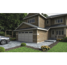 Exteriér dvoupodlažního domu s garáží, kamenným schodištěm a upraveným trávníkem