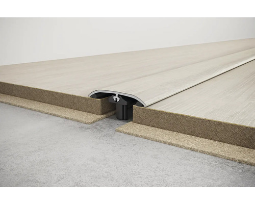 Podlahový profil pro spojení dvou podlahových krytin.