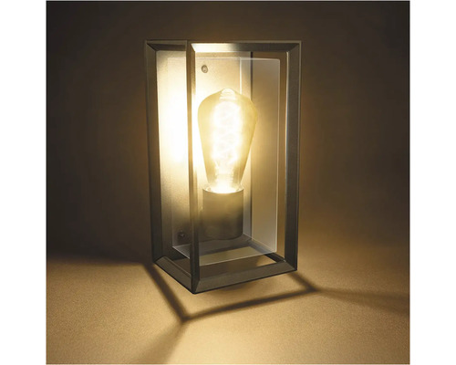 Nástěnné svítidlo s průhledným pouzdrem a žárovkou