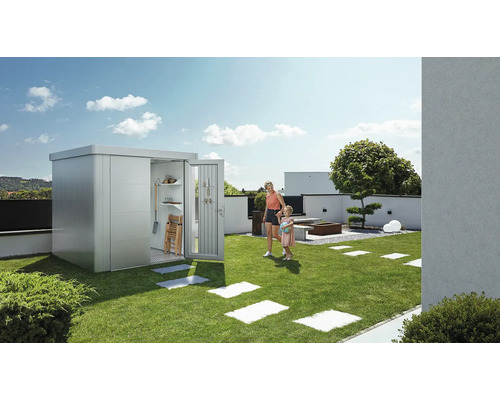 Zahradní scéna s domkem na nářadí, matkou a dítětem na trávníku