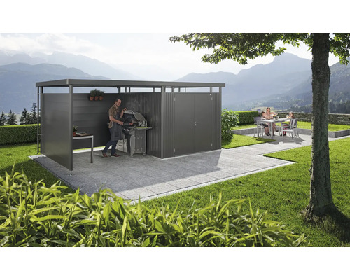 Moderní zahradní salonek s grilem a posezením na dlážděné terase