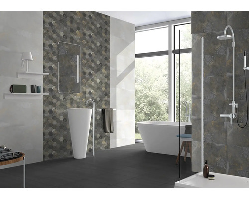 Moderní koupelna s volně stojící vanou, sprchou, umyvadlem a šestiúhelníkovými obklady.