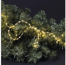 Dekorativní jedlová větev s teplým bílým světelným řetězem