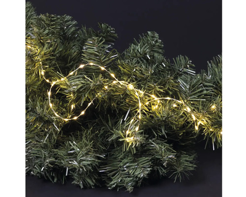 Dekorativní jedlová větev s teplým bílým světelným řetězem