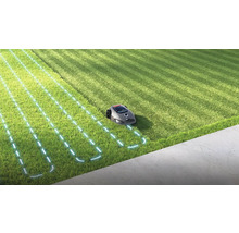 Robotická sekačka v provozu na trávníku