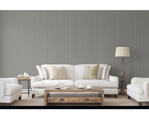 Obývací pokoj s šedým obložením stěn, pohovkou a příručním stolkem