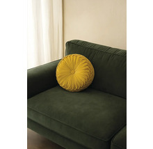 Kulatý dekorační polštář na pohovce