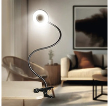 Svítidlo s klipem, flexibilním ramenem a kruhovým LED světlem na stole