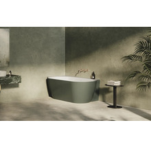 Moderní koupelna s volně stojící vanou, umyvadlem a rostlinou pro relaxační atmosféru.