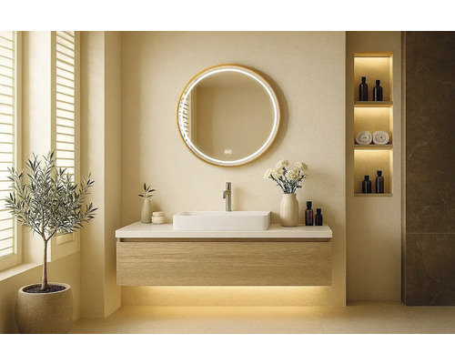 Moderní koupelna s umyvadlem, kulatým zrcadlem a dekorativními prvky pro stylové prostředí