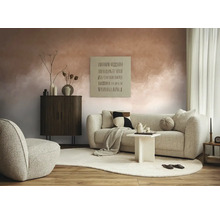 Obývací pokoj s pohovkou, křeslem, skříní a dekorativními prvky na koberci