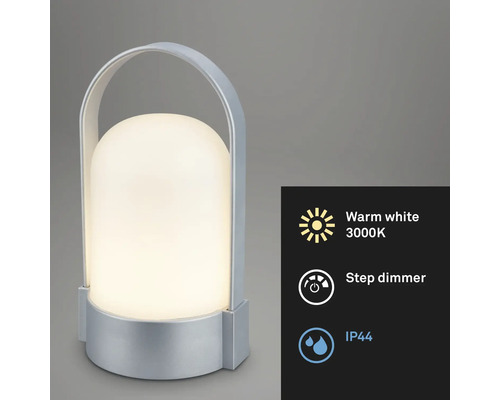 Přenosná LED stolní lampa se stříbrným tělem a rukojetí, teplé bílé světlo 3000 Kelvinů, stupňovitý stmívač a stupeň krytí IP44.