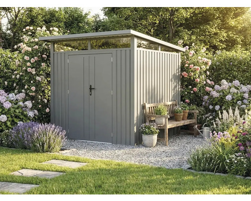 Moderní kovový zahradní domek s pultovou střechou a dvojitými dveřmi v kvetoucí zahradě vedle dřevěné lavice.