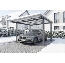 Moderní hliníkový přístřešek pro auto s SUV pod ním v zasněžené zimní krajině.