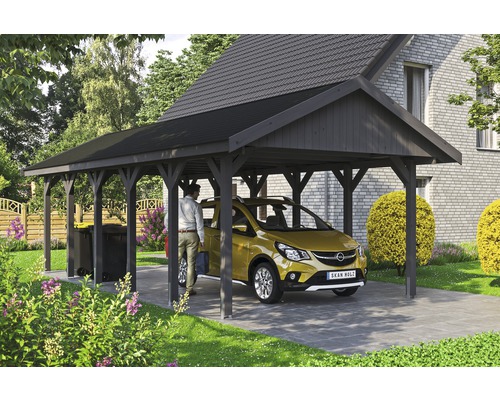 Přístřešek na auto SKAN HOLZ Wallgau 430 x 900 cm břidlicově šedý vč. šindelů Dřevěný přístřešek pro auto s autem a osobou na zahradě.