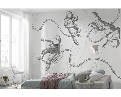 Ložnice s fototapetou s motivem astronautů na zdi