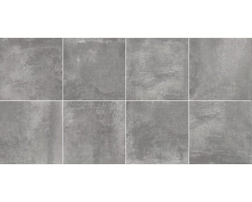 Šedé dlaždice s cementovým vzhledem, vhodné pro obklady stěn a podlah.