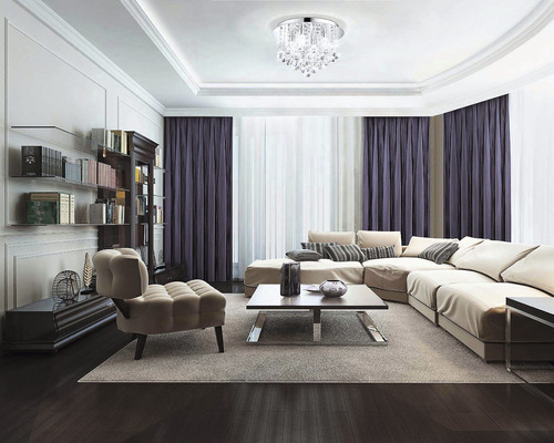 Obývací pokoj s pohovkou, křeslem, knihovnou a stropním svítidlem