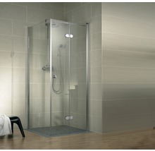 Rohová sprcha s otočnými dveřmi a sprchovou baterií v koupelně.