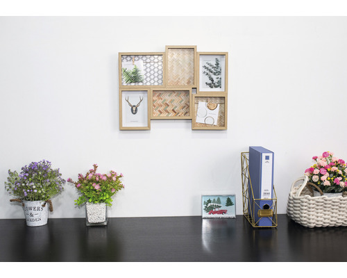 Nástěnná dekorace s rámy a dekorace na psací stůl