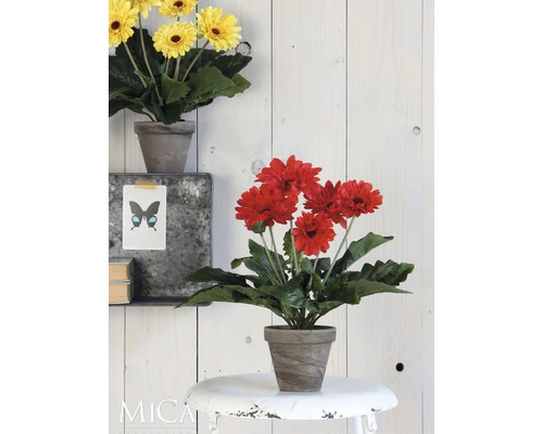 Dekorativní umělá květina Gerbera v květináči jako dekorace na stůl