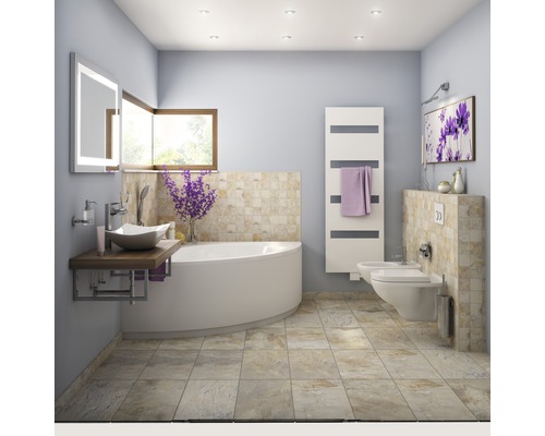 Světlá koupelna s vanou, umyvadlem, toaletou a bidetem.