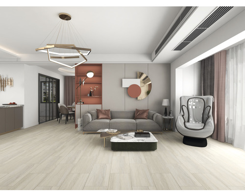 Světlý obývací pokoj s pohovkou, křeslem, konferenčním stolkem a závěsným svítidlem