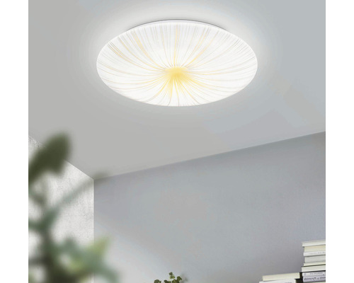 Kruhové stropní svítidlo s abstraktním vzorem v zapnutém stavu